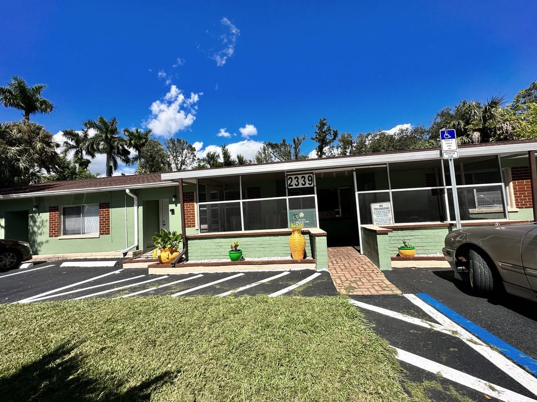 Exterior view of senior living facility with landscaping