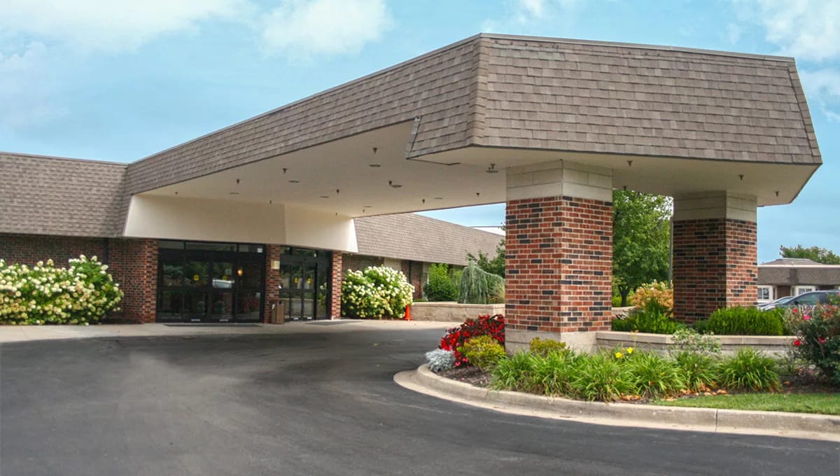 Entrance of Foxwood Springs Senior Living with landscaping