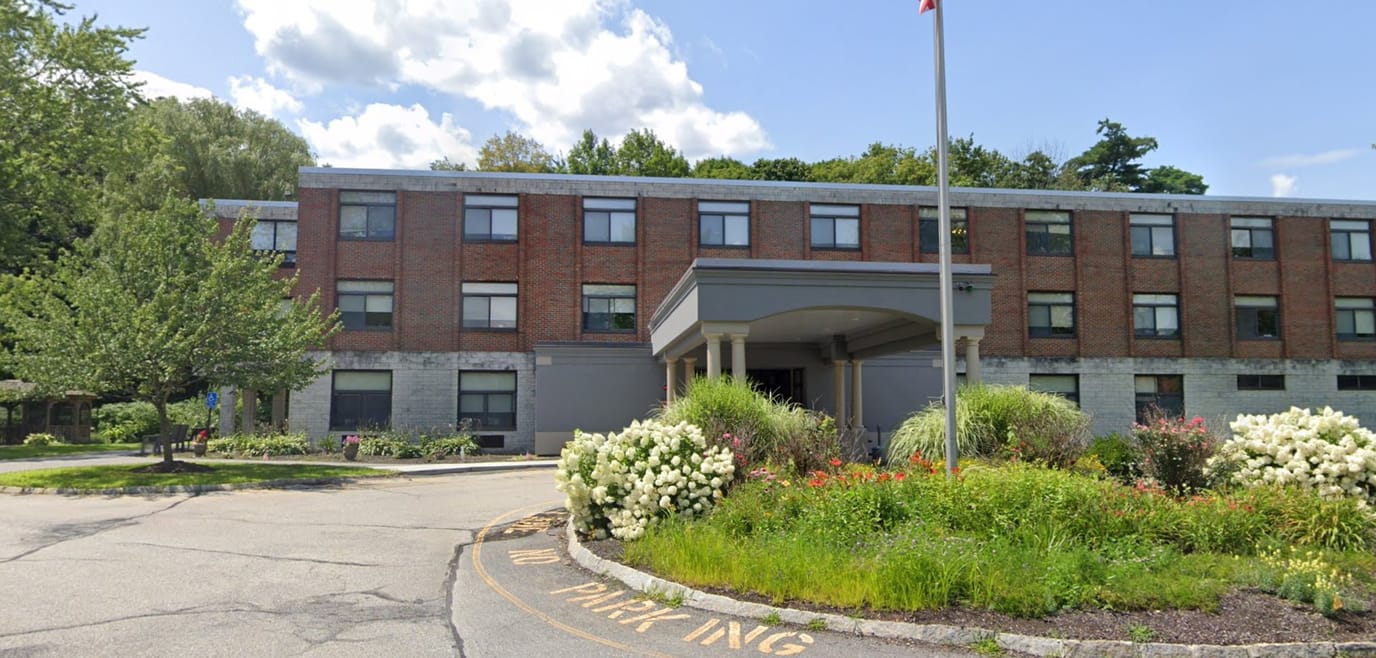 Exterior view of Harris Hill Center with landscaped entrance