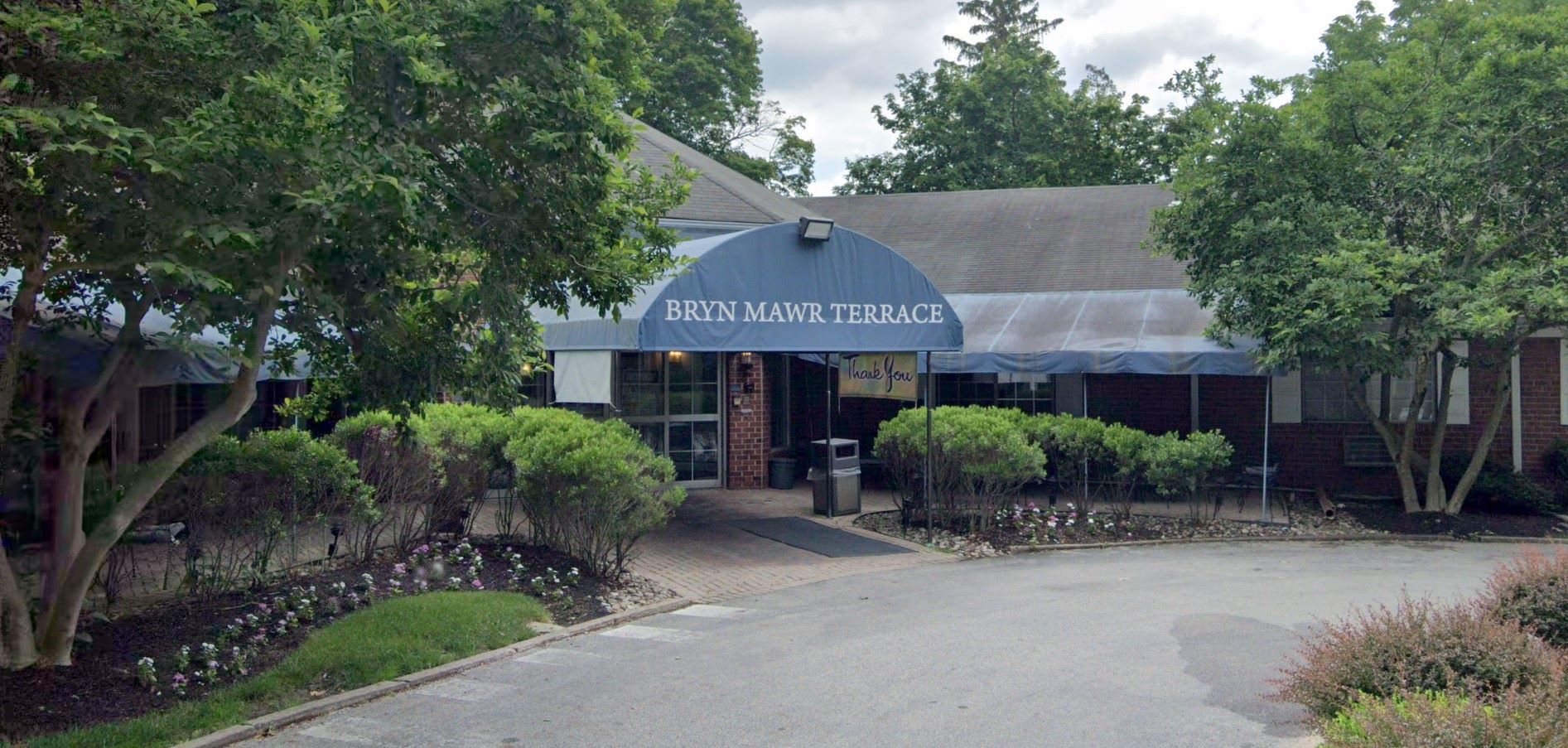 Entrance to Bryn Mawr Terrace showing garden and awning
