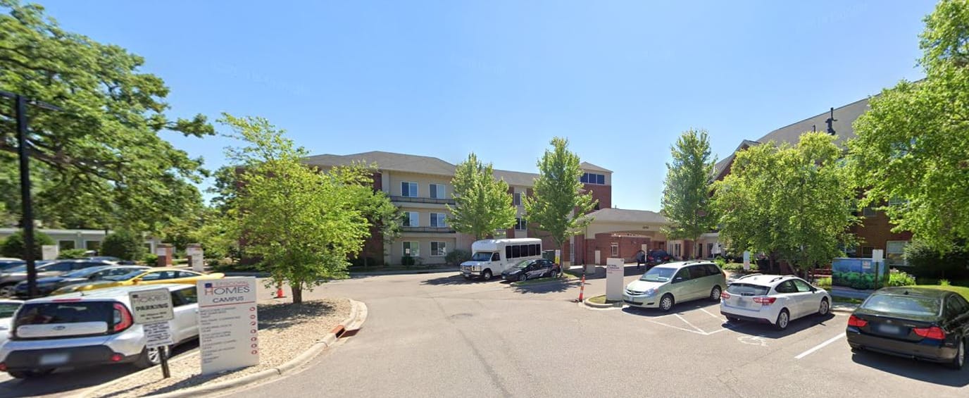 Exterior view of Katy's Cottage Memory Care with parking