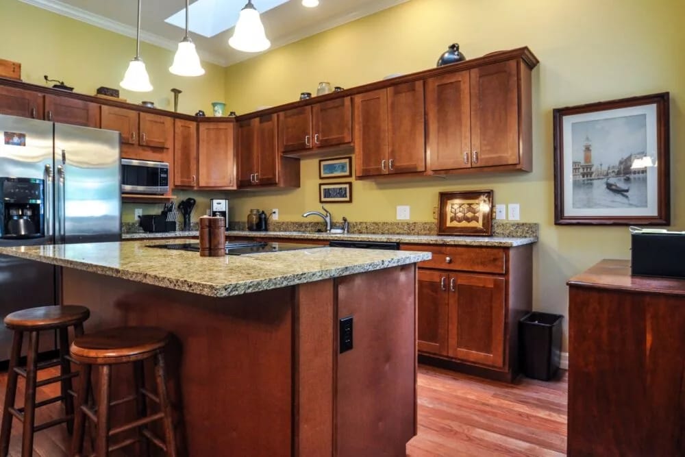Bright modern kitchen with wooden cabinets and granite countertops