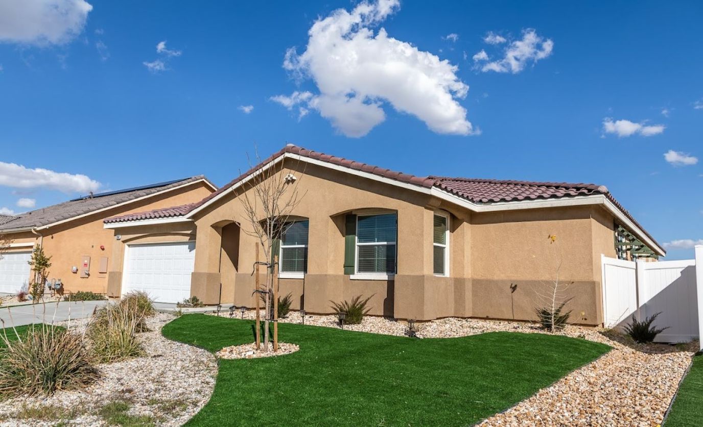 Exterior view of a senior living facility with landscaping