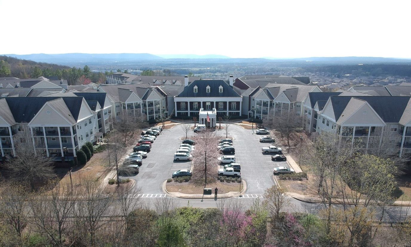 Aerial view of Redstone Village with parking and buildings