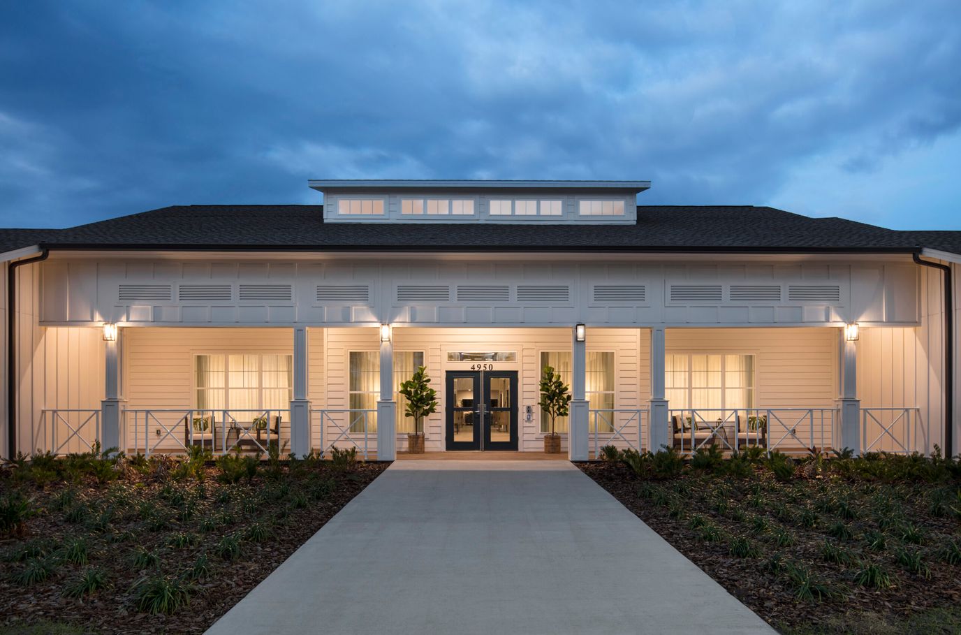 Exterior view of Senior Living facility entrance at dusk