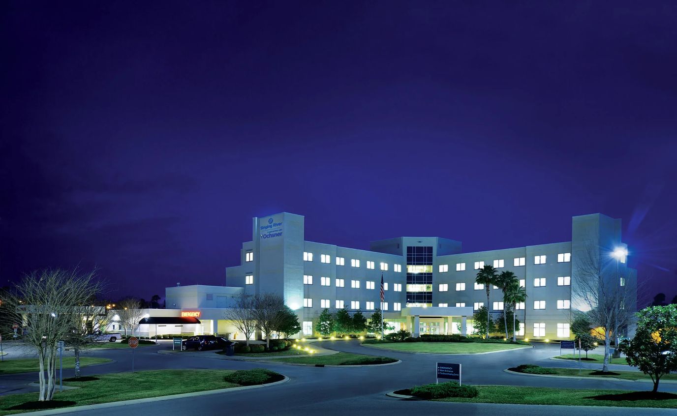 Exterior view of Singing River Gulfport Skilled Nursing Facility at night