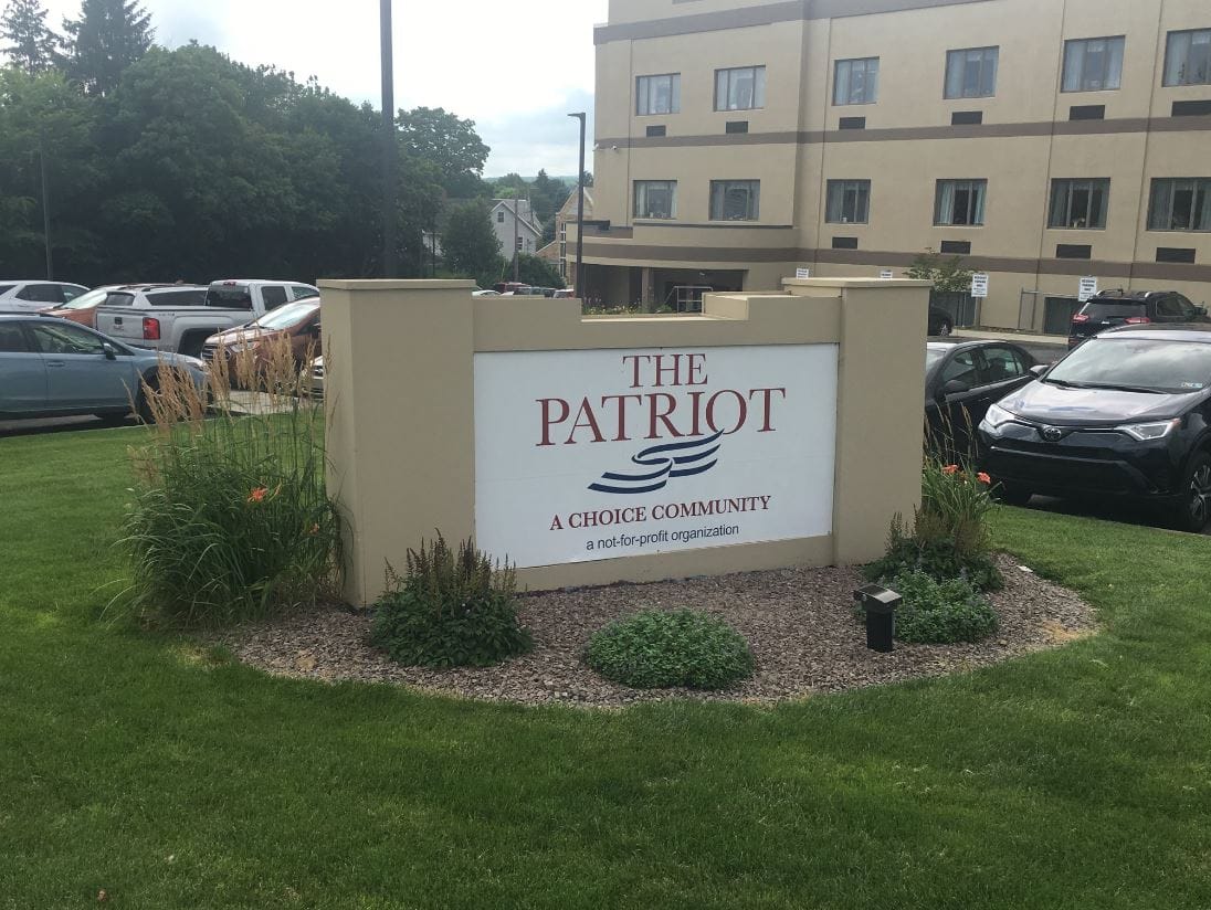Sign for The Patriot, a Choice Community, outside the facility