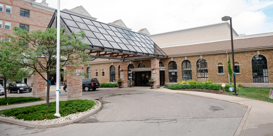 Entrance of a senior living facility with outdoor space