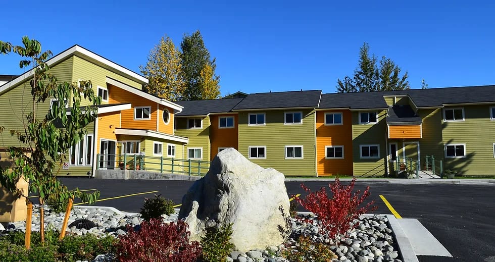 Exterior view of Campbell Creek House with garden and landscaping