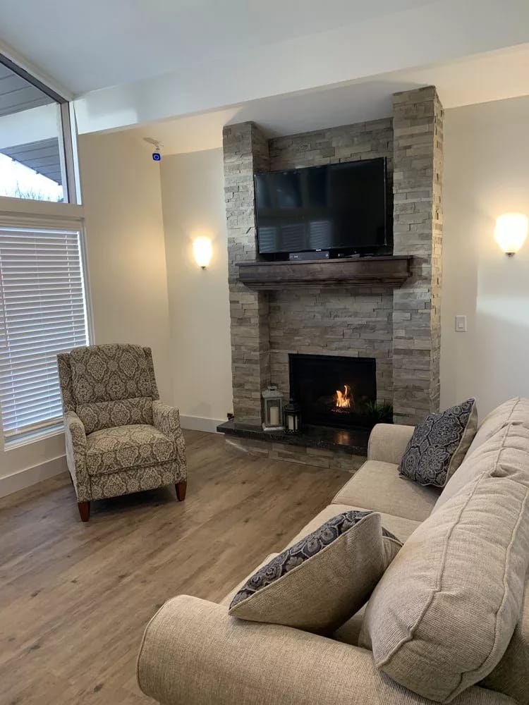 Cozy common area with a fireplace and seating