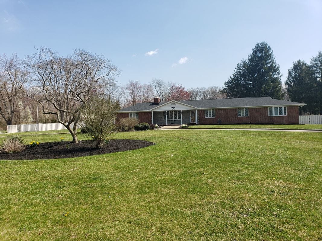 Exterior view of The Paragon Manor with landscaped grounds
