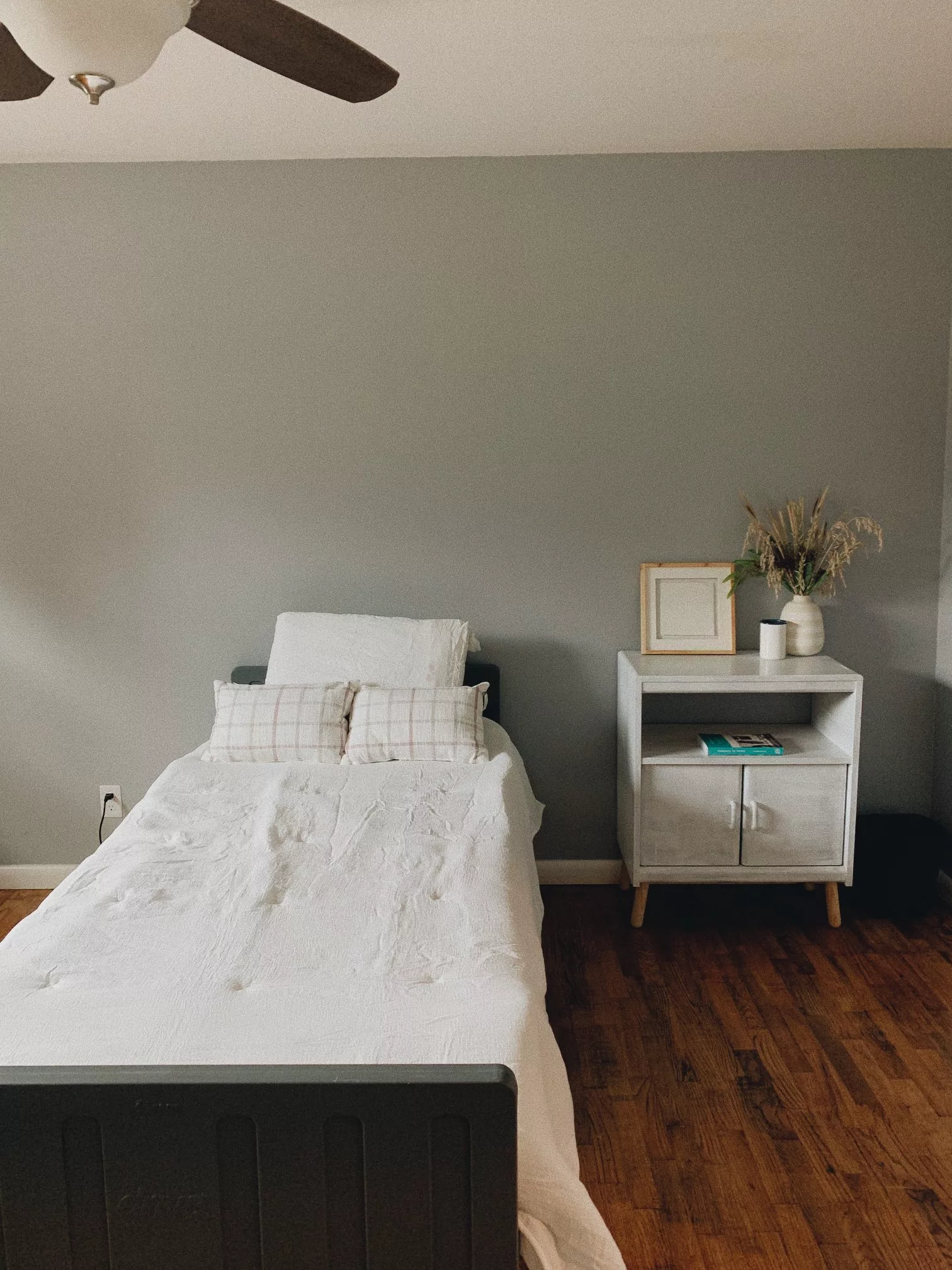 Cozy resident room with a bed and nightstand