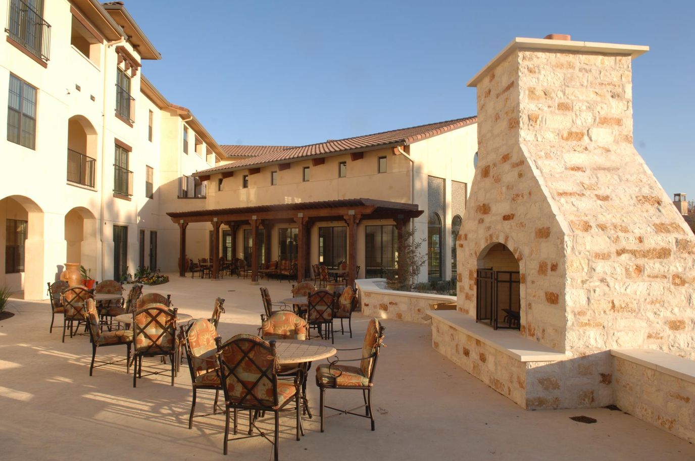 Outdoor patio area with tables and chairs