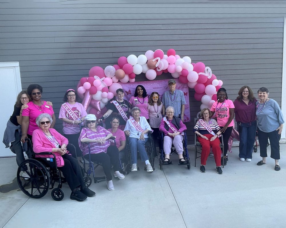 Mira at Maumelle, assisted living in Maumelle, AR — Group of seniors celebrating at a pink-themed event