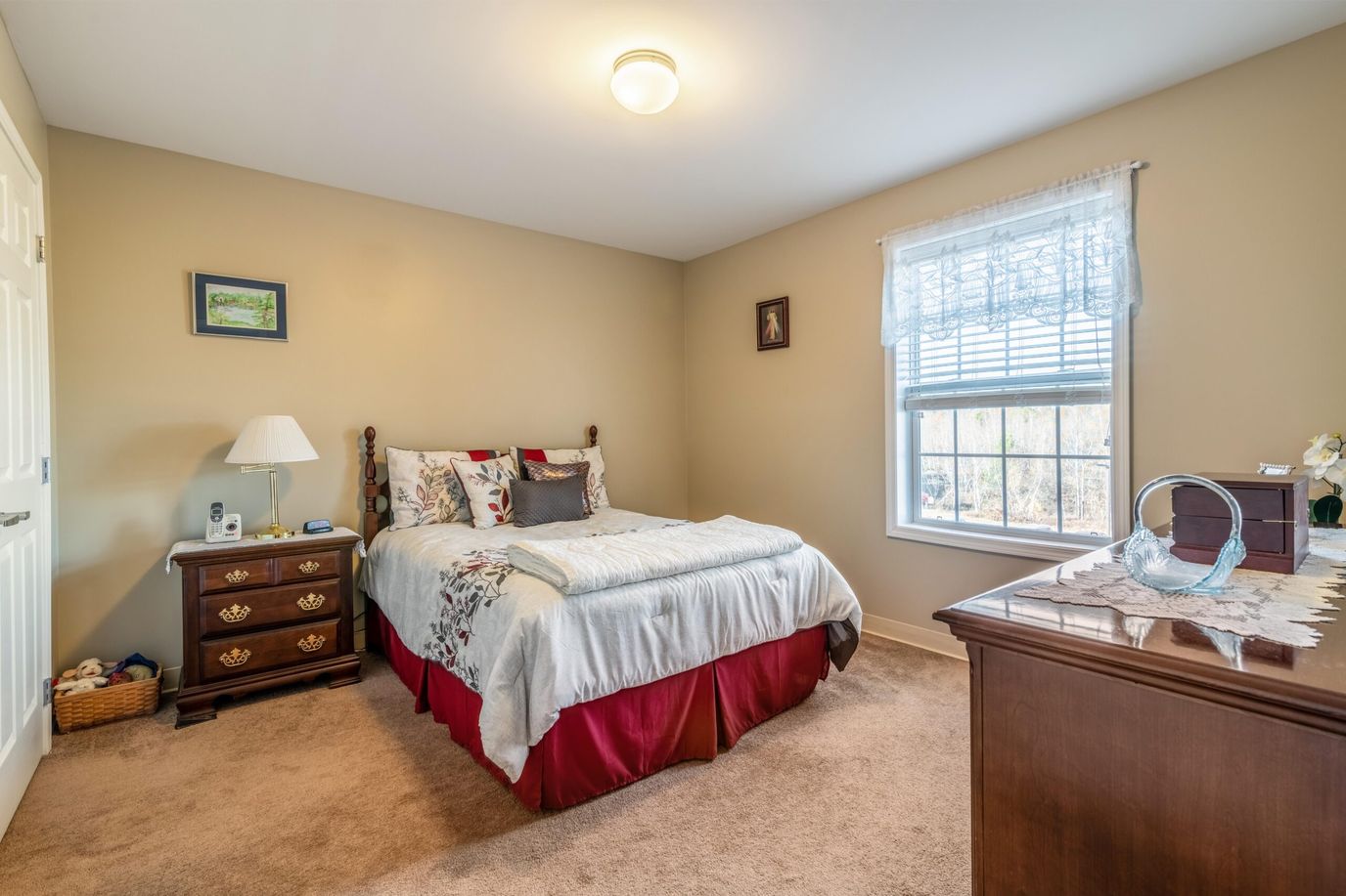 Connect55+ Concord, assisted living in Concord, NH — Cozy bedroom with a bed and window view