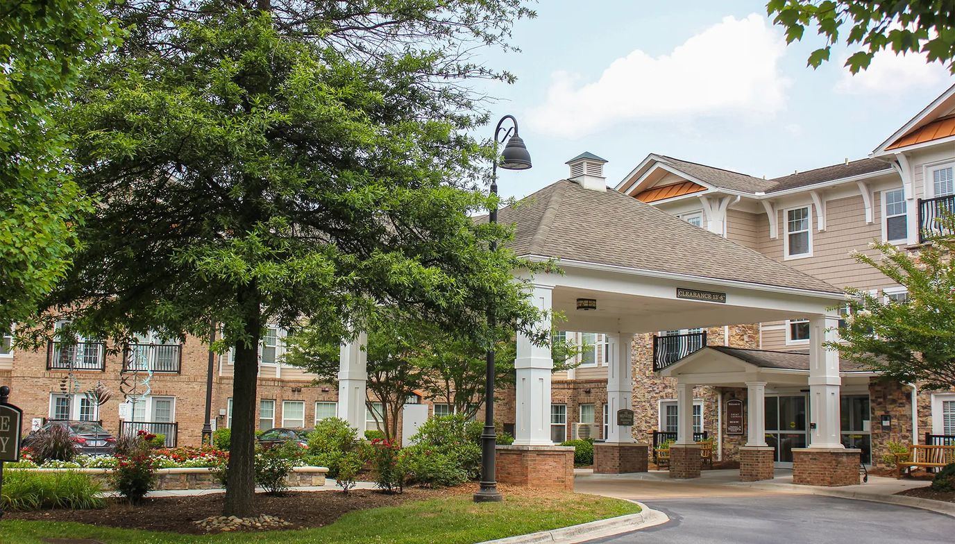 Entrance of a senior living facility with landscaping