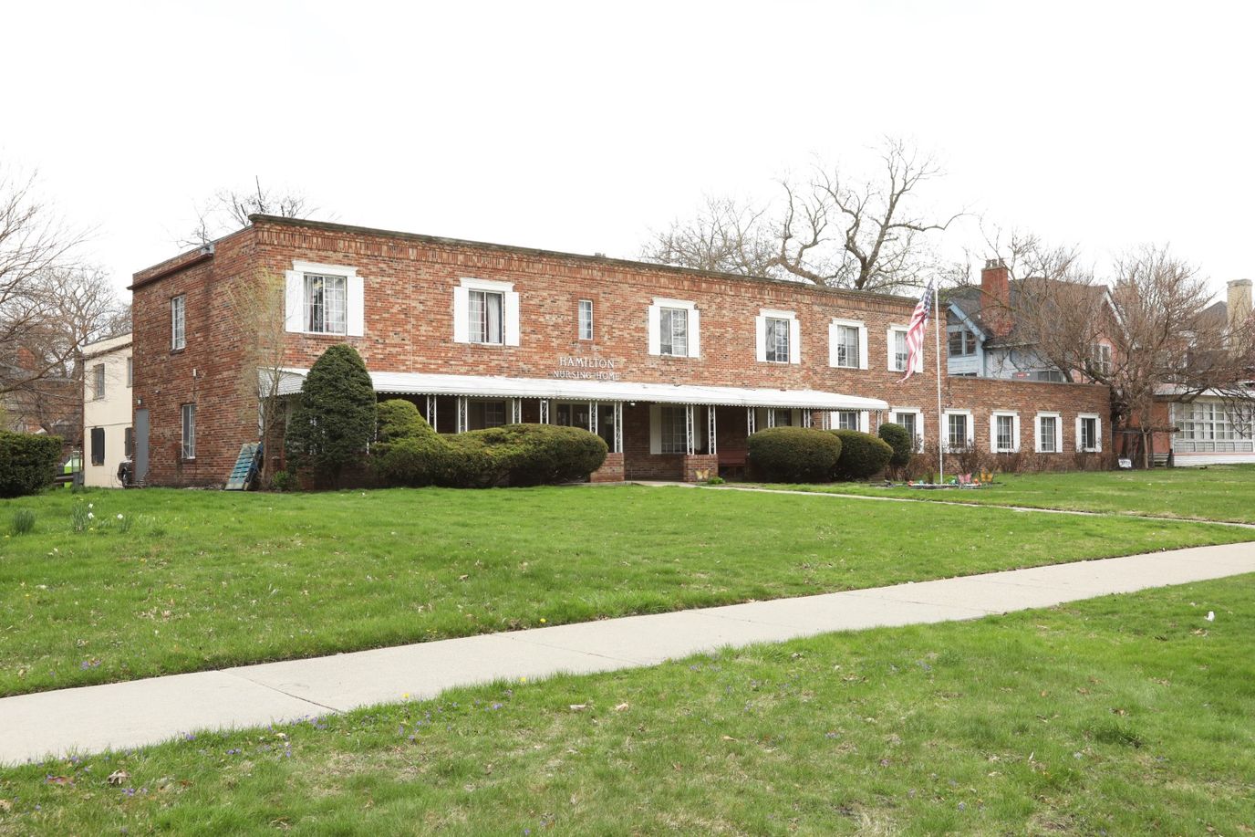 Exterior view of the brick facility with green lawn