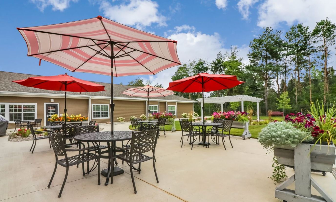 Outdoor seating area with umbrellas and flowers