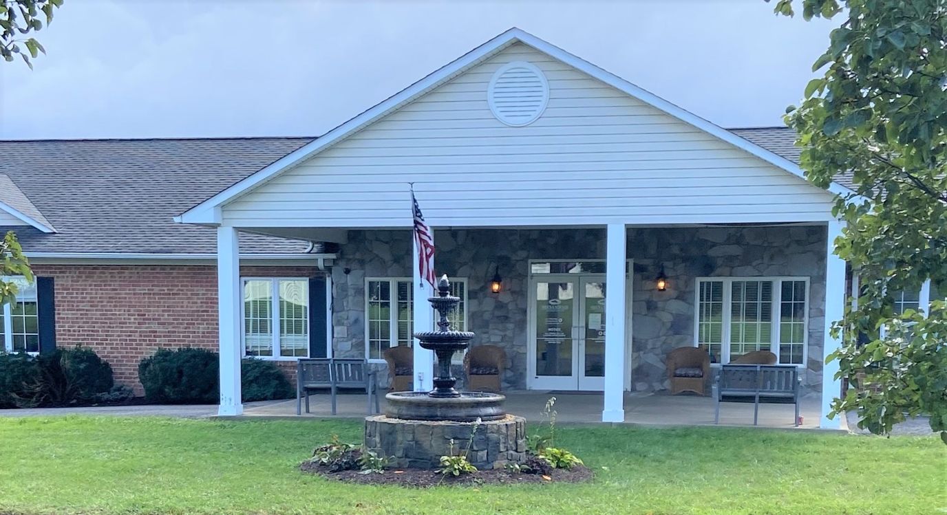 Front entrance of Shenandoah Senior Living with a fountain