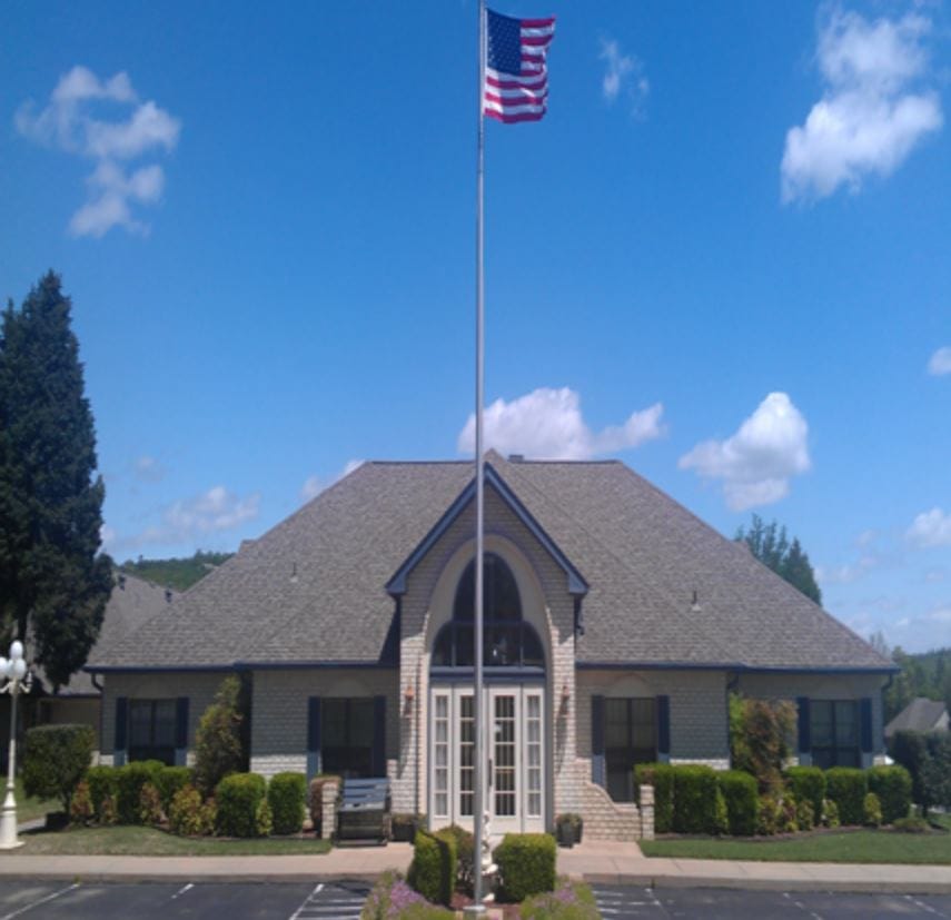 Exterior view of Golden Years Retirement Village with flag