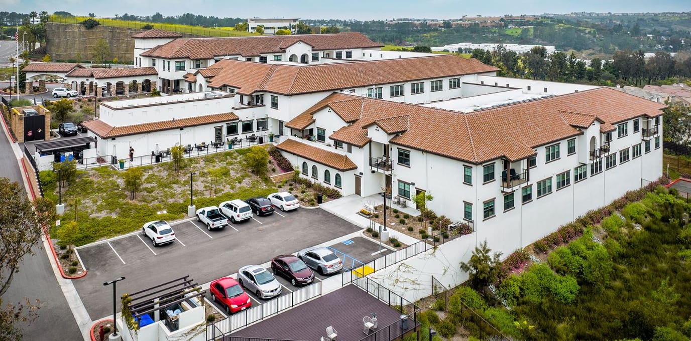 Aerial view of La Marea Senior Living facility with parking lot