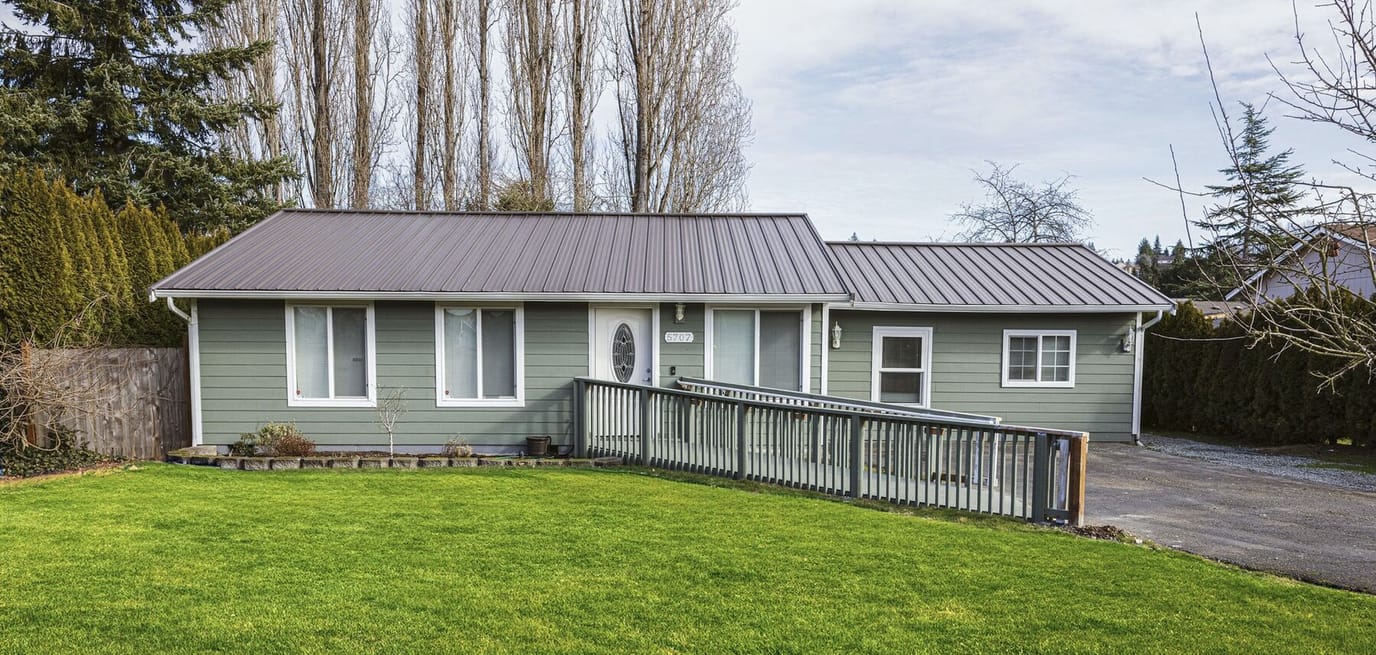 Exterior view of a green adult family home