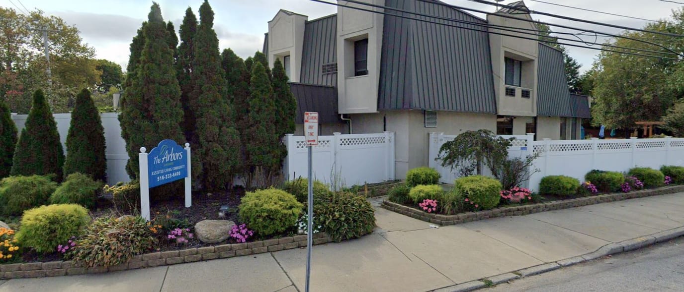 Exterior view of The Arbors Assisted Living facility