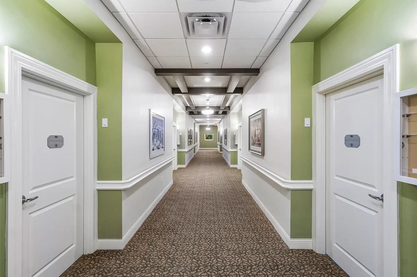 A well-lit hallway in a senior care facility