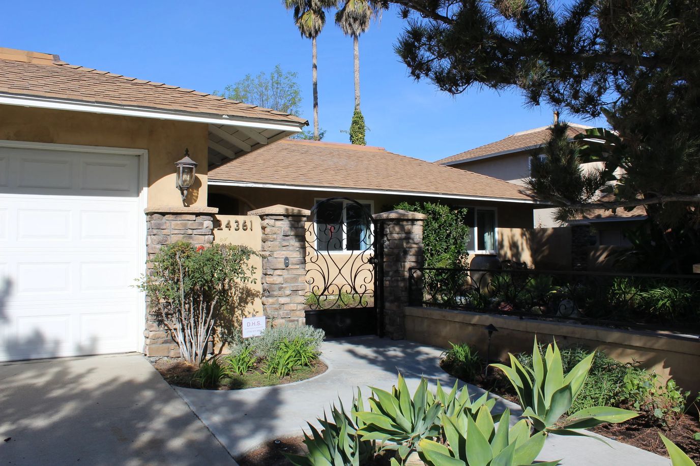 Exterior view of Agustin Gardens facility entrance