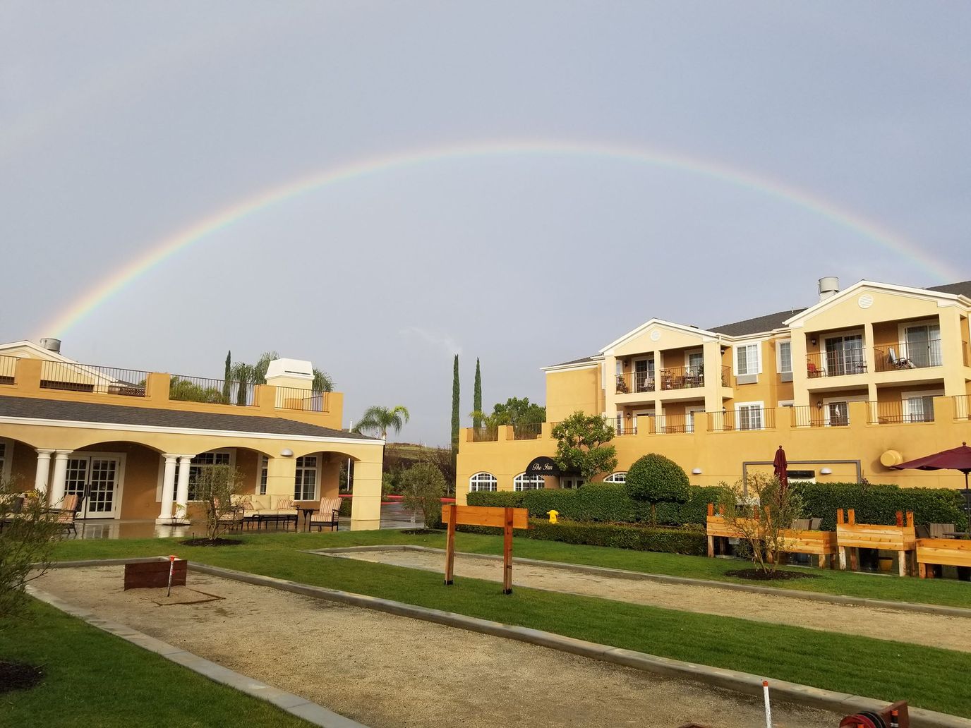 Residential buildings with a rainbow in the background