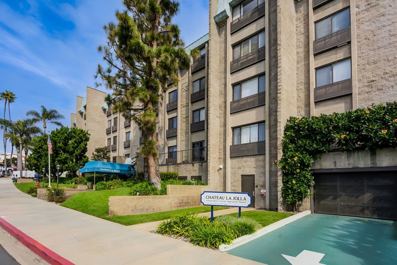 Exterior view of Chateau La Jolla facility with landscaping