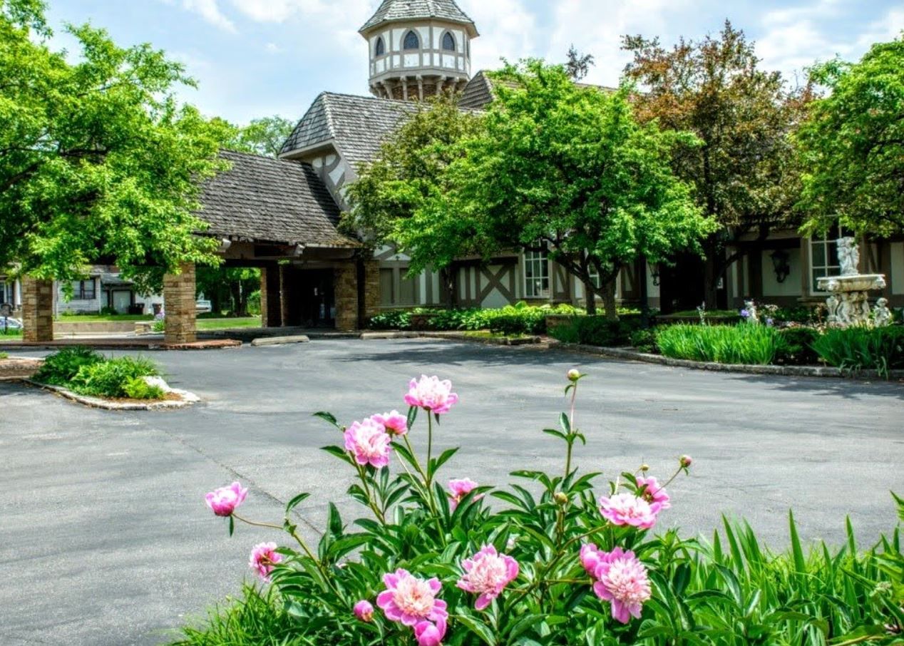 Exterior view of assisted living facility with flowers