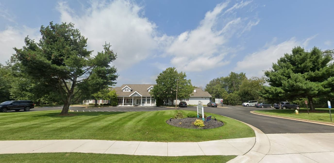 Exterior view of Lake House Kalamazoo with landscaped lawn
