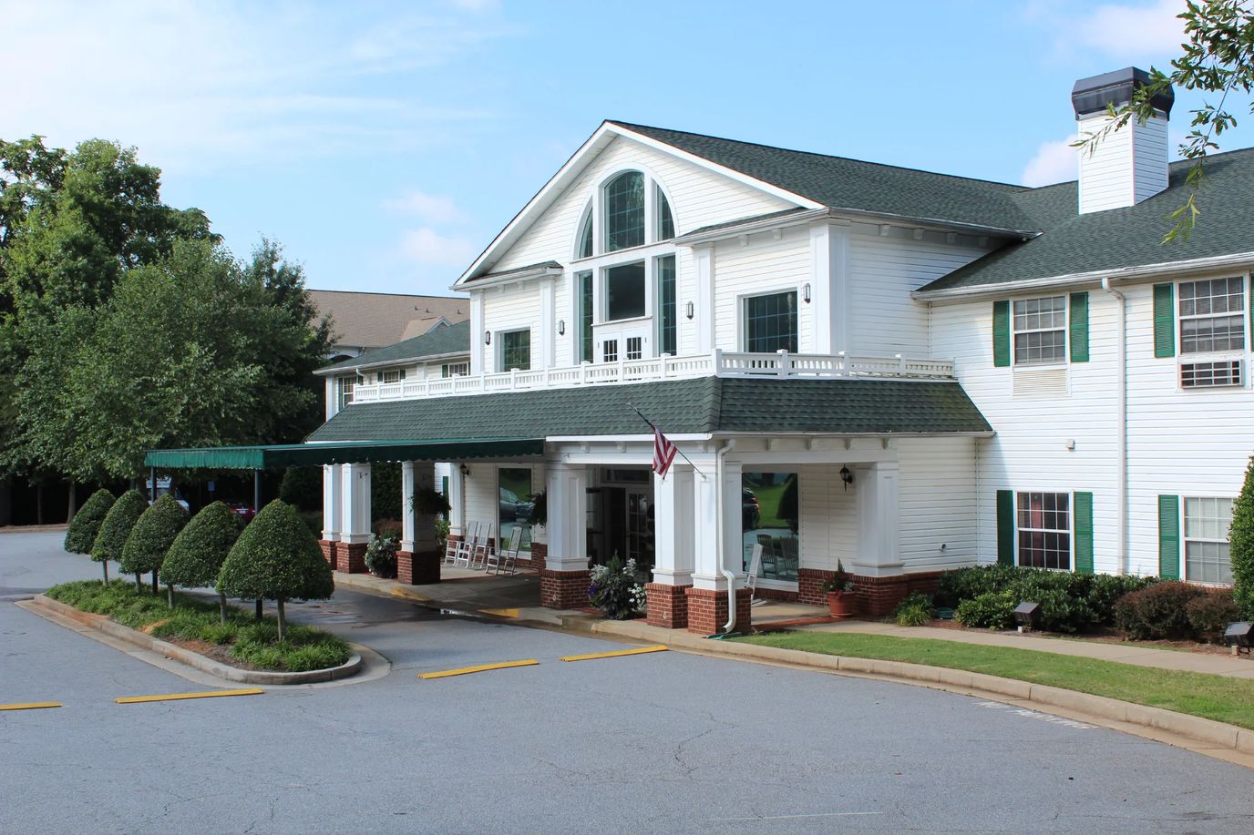 Entrance of Oaks at Tucker with landscaped outdoor area