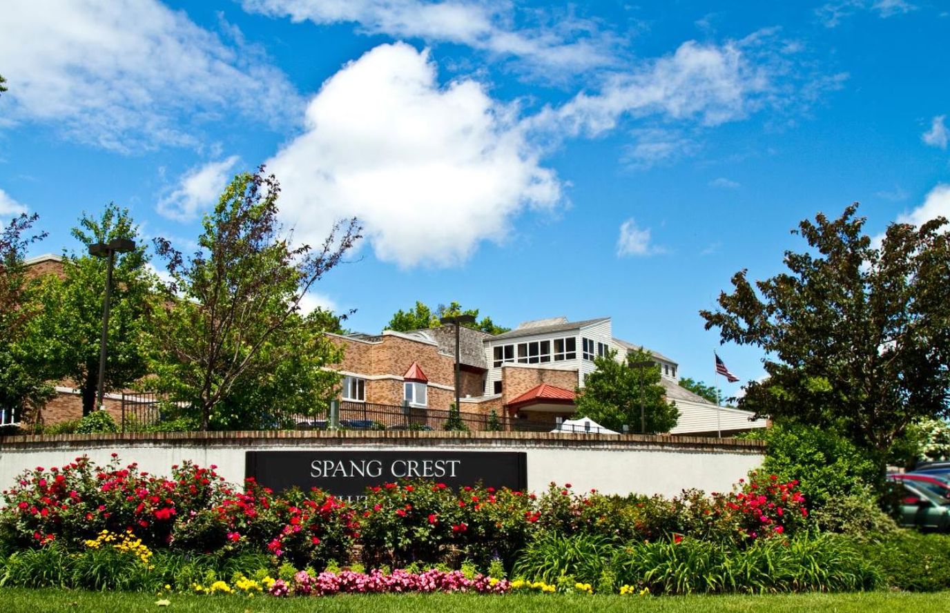 Exterior view of Spang Crest with flowers and blue sky