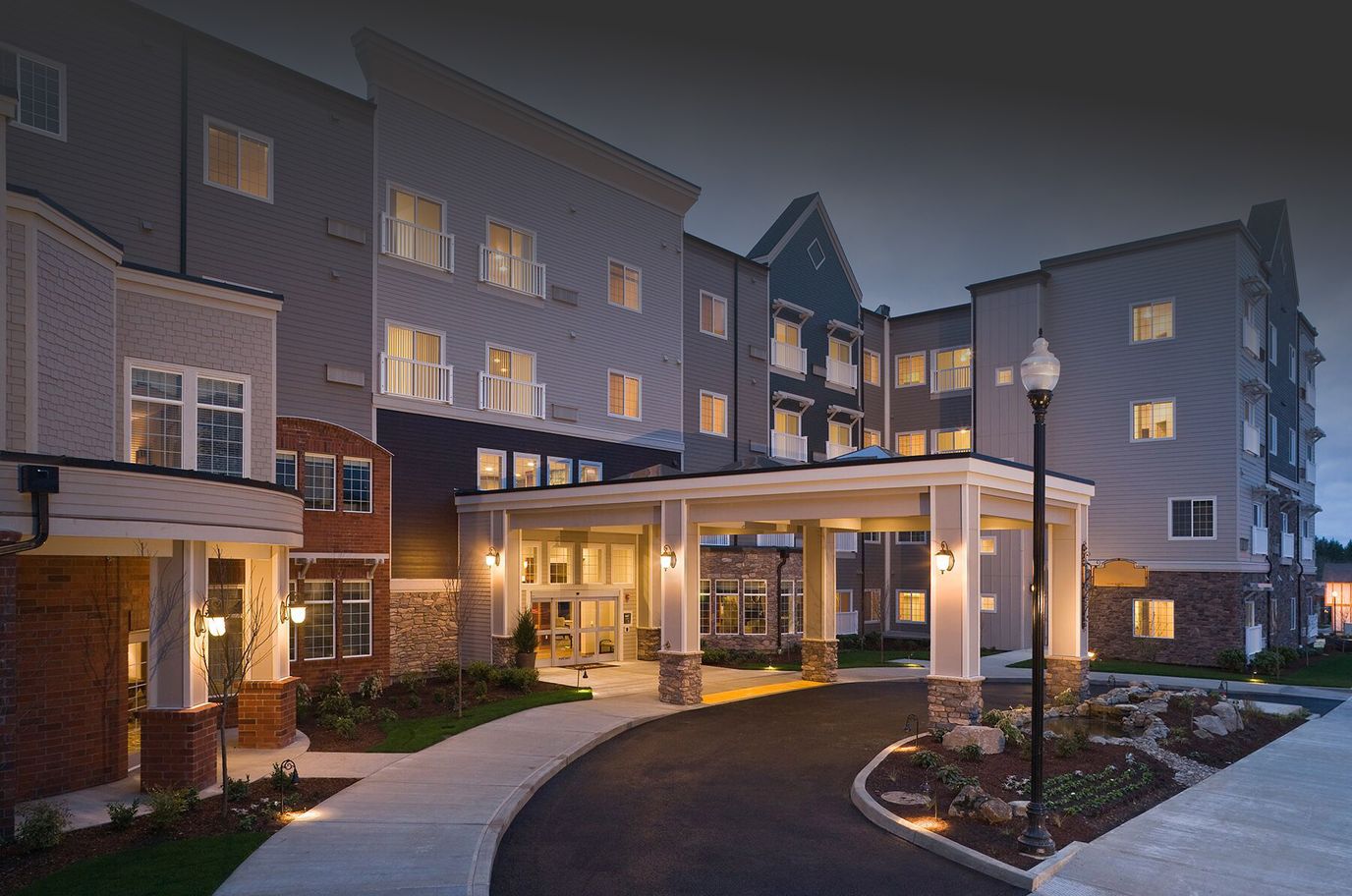 Exterior view of Laurel Parc building at dusk