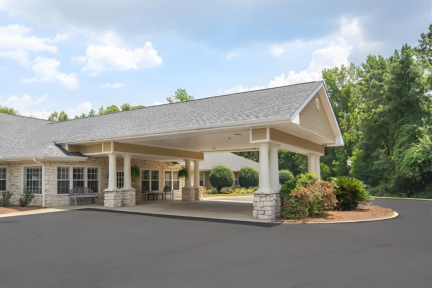 Front entrance of a senior living facility with landscaping