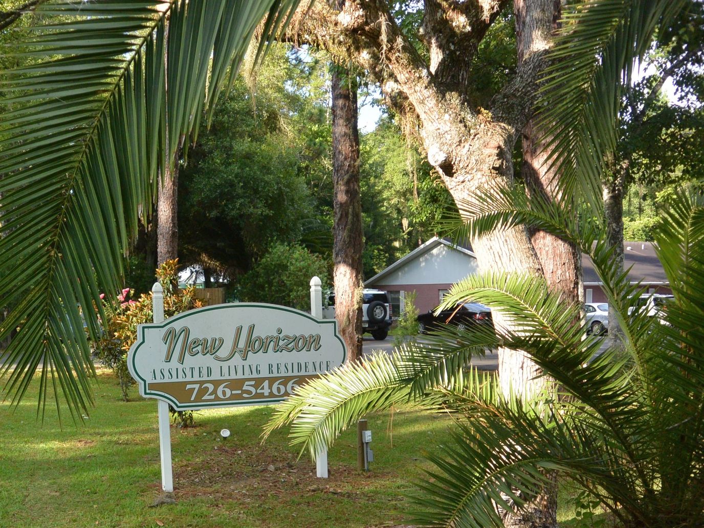 Sign of New Horizon Assisted Living Residence among trees
