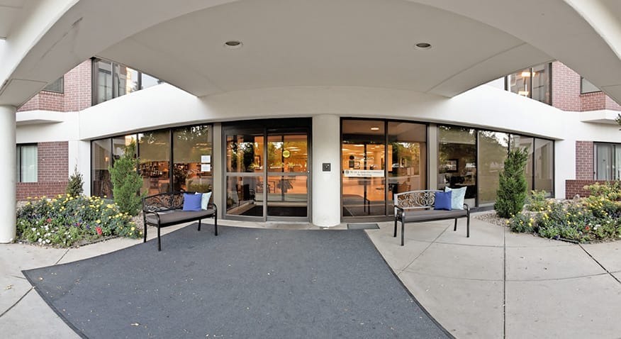 Entrance to assisted living facility with seating area