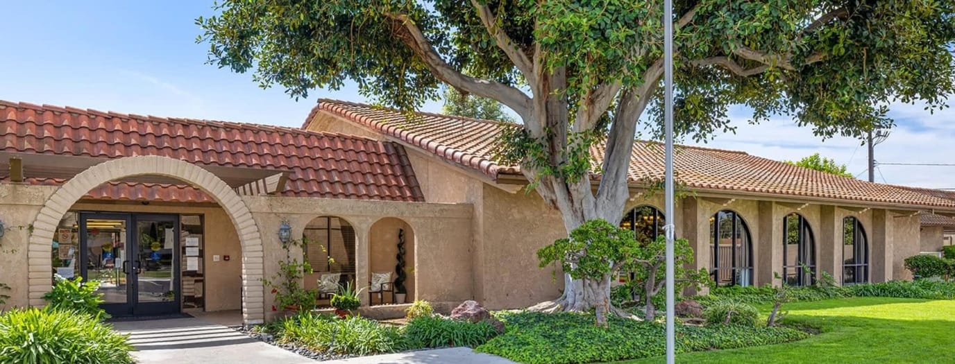 Exterior view of Brookdale Garden Grove with landscaped gardens