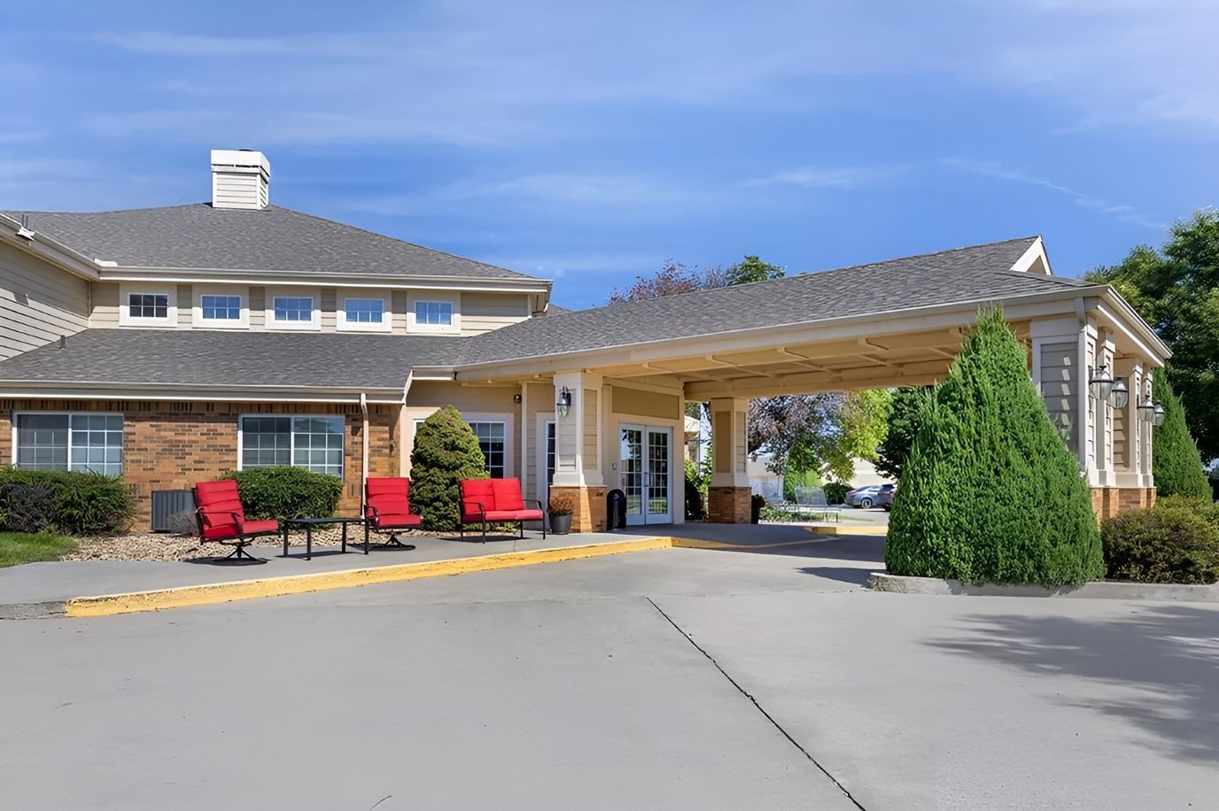 Entrance of Brookdale Liberal Springs with seating area