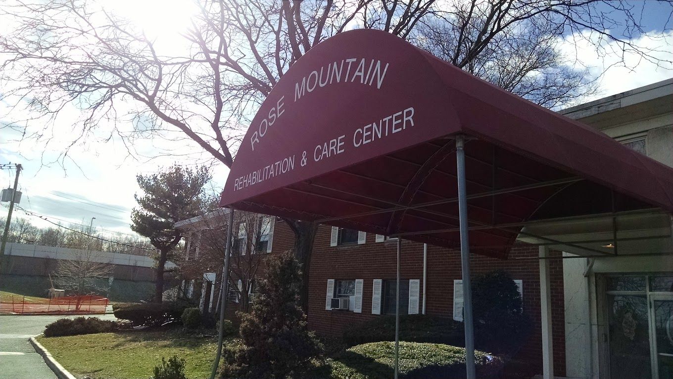 Entrance with canopy of Rose Mountain Rehabilitation & Care Center