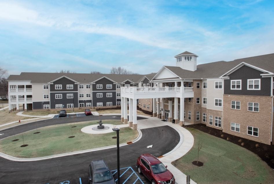 Exterior view of Avalon Senior Living building with landscaped entrance