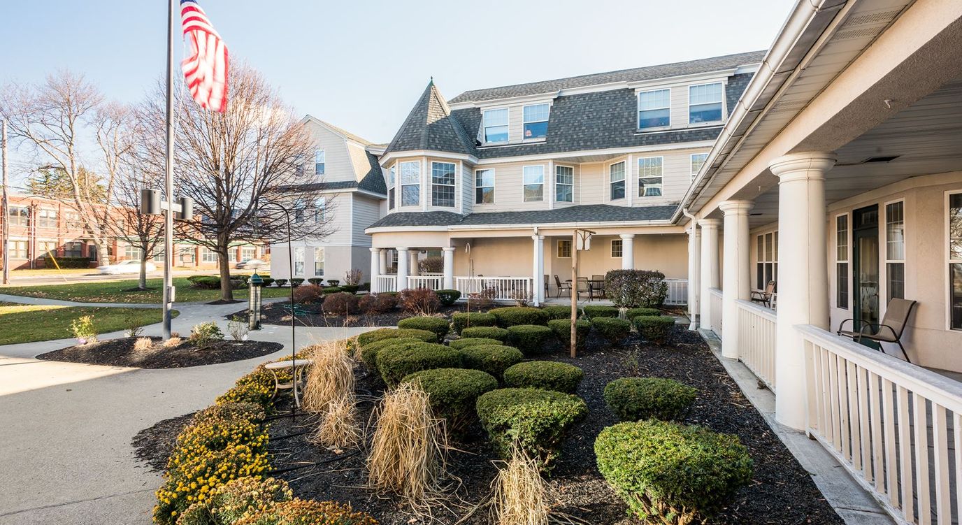 Front exterior view of Brookdale Niskayuna with landscaping