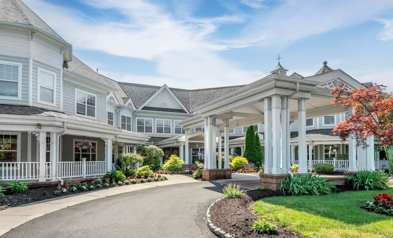Exterior view of a beautifully landscaped assisted living facility