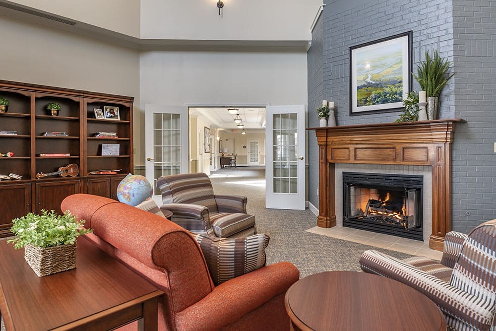 Cozy lobby area with seating and a fireplace