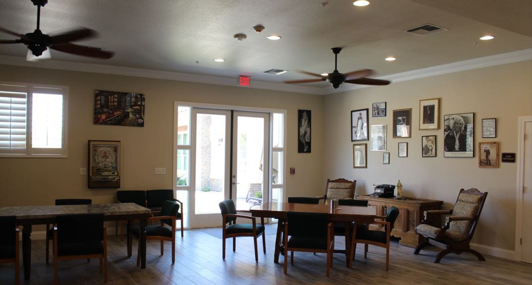 Cozy common area with wooden tables and chairs