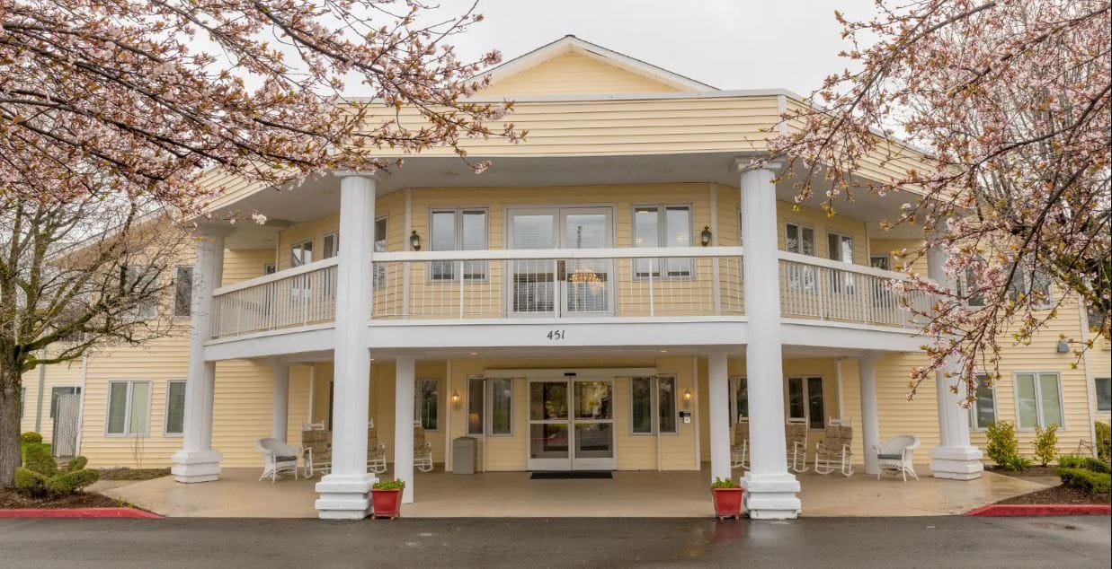 Front entrance of Hilltop Estates with cherry blossoms