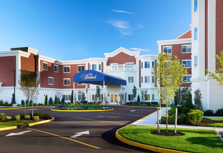 Exterior view of The Bristal at Holtsville with landscaping