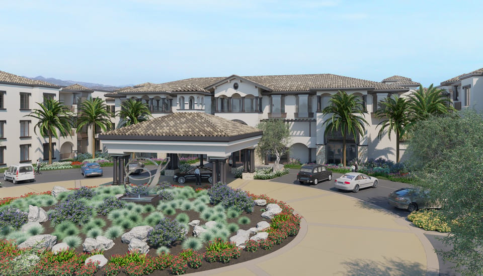 Exterior view of a senior living facility with gardens and entrance